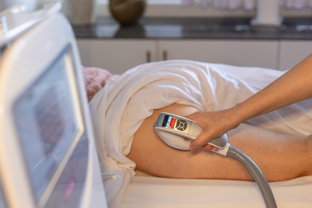 A VelaShape III applicator in use on a thigh